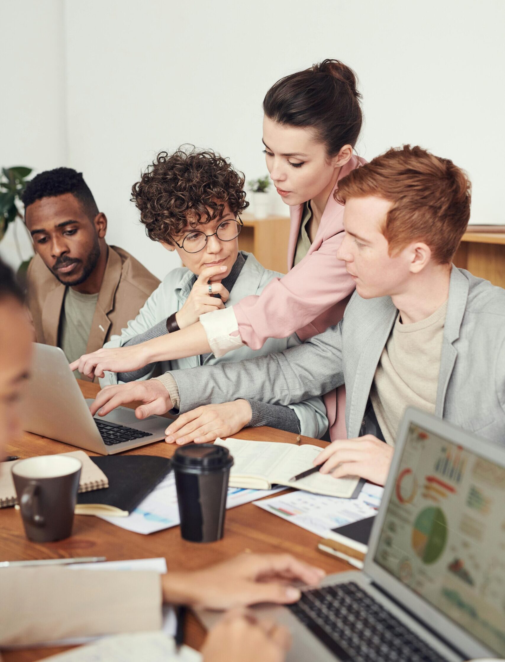 A group of professionals engaged in a collaborative meeting, discussing ideas for Semiconductor Technical Recruitment Solutions